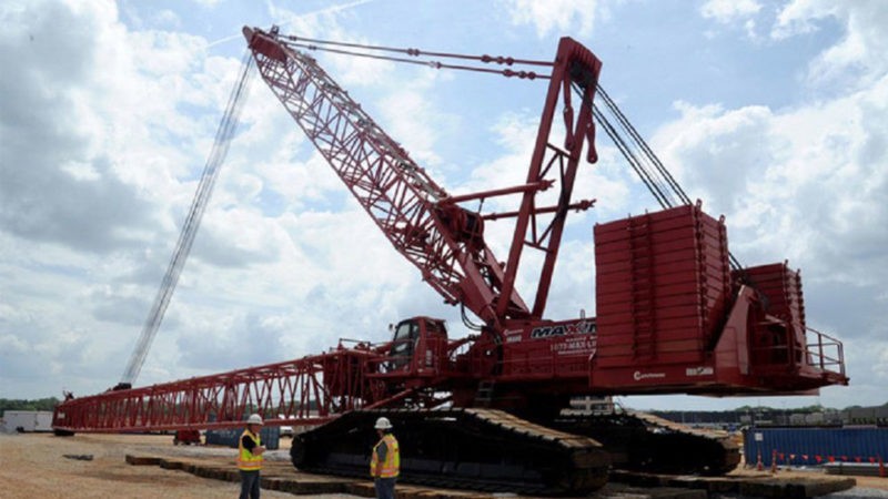 Big red crane is leaving the building